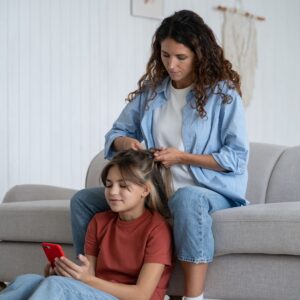 mother-making-school-hairstyle-for-beloved-daughte-2023-11-27-05-06-00-utc-scaled (1)